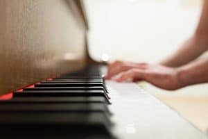 Hands playing piano